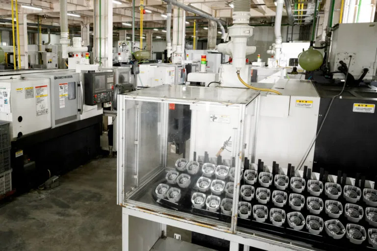 Automated CNC machining facility at JoinCast featuring a row of high-precision lathes for mass production of aluminum die cast components.