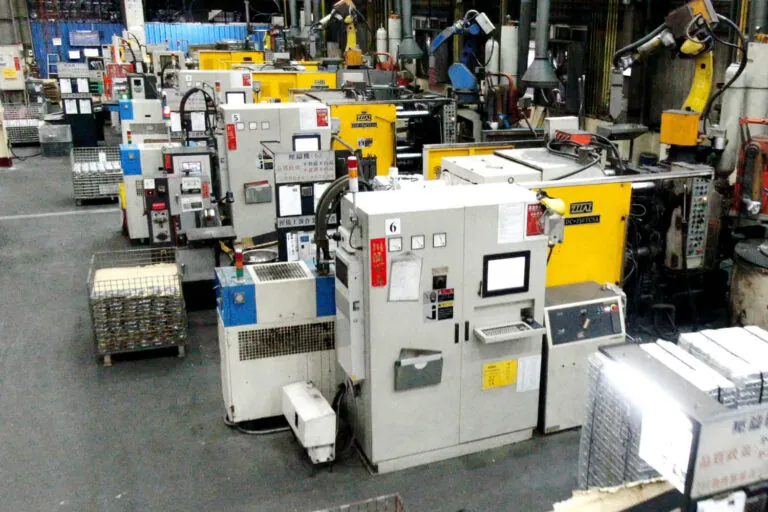 Large-scale aluminum die casting facility in Taiwan featuring a row of cold chamber machines for high-volume OEM component production.