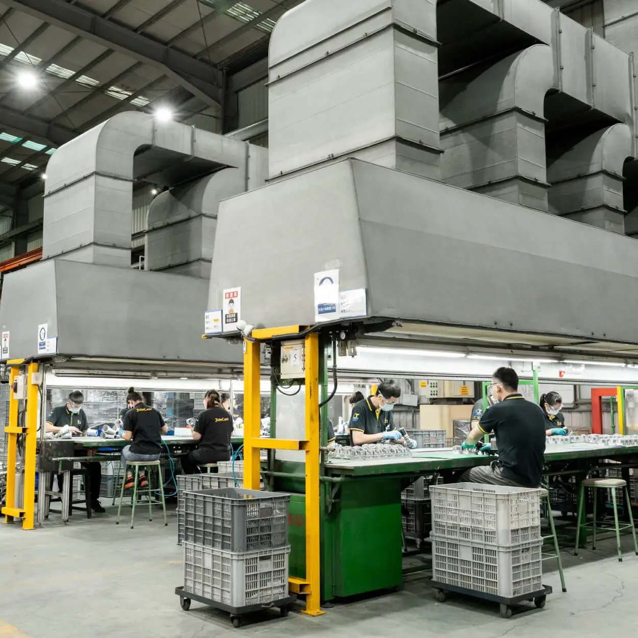 A dedicated 170-person manufacturing team performing quality inspection and precision assembly within a vertically integrated production facility.