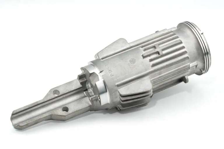 Raw ADC-12 aluminum die cast internal motor housing for pneumatic tools, showcasing high structural integrity and cooling fin geometry.