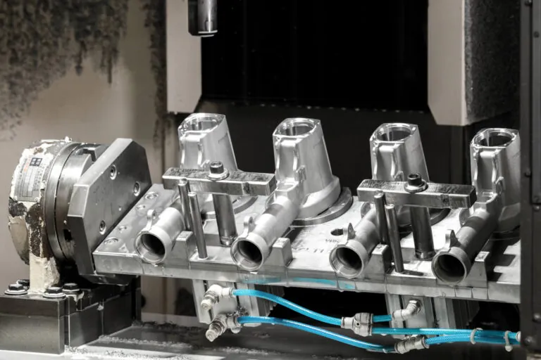 Automated robotic production line performing secondary CNC machining on pneumatic tool bodies to achieve essential ±0.01 mm tolerances.