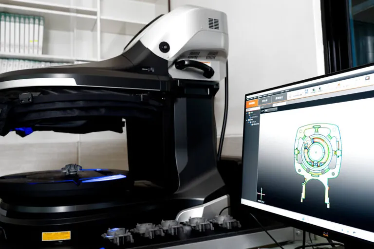 In-line automated inspection system comparing 3D scan data against CAD models for real-time process monitoring and scrap reduction.