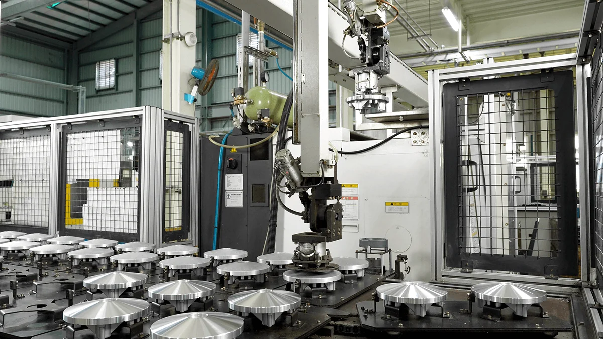 In-line automation system for efficient transfer and positioning of aluminum die castings between machining stations.