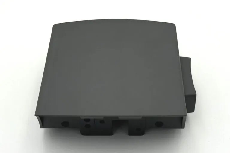 Black powder-coated aluminum die-cast controller enclosure providing enhanced emissivity and corrosion resistance for industrial electronics.